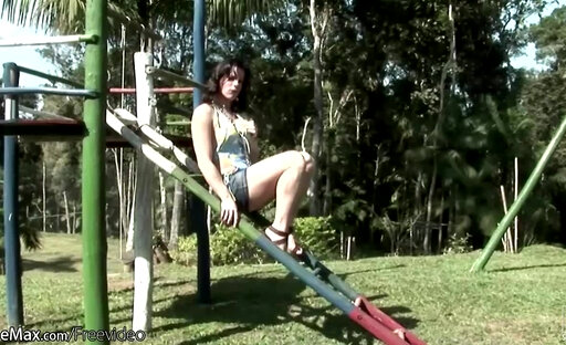 Naked t-girl swinging in the park gets covered in chocolate