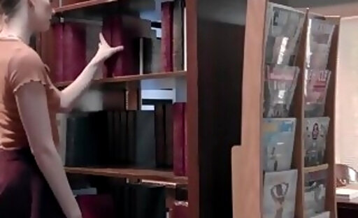 Erin and Ariel bangs in between bookshelves