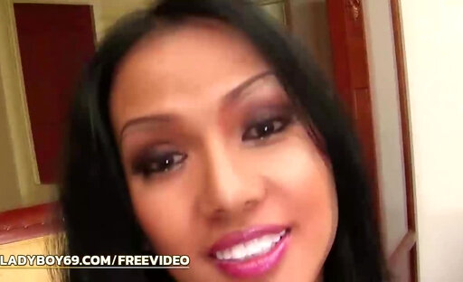 Brunette ladyboy in pink and white panties shoves an anal toy up her shaved ass