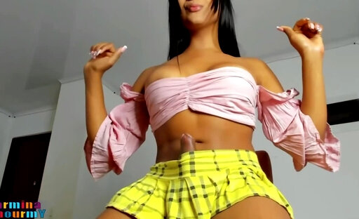 Carmina Teases In Skirt As She Strokes Huge Cock To Climax!
