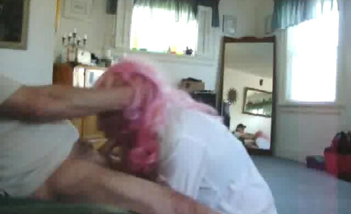 Pink hair crossdresser gives a bj