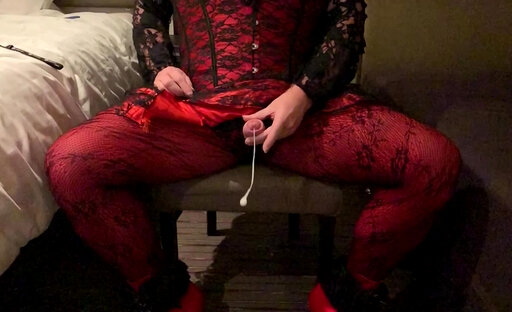 Crossdresser cums in red and black outfit