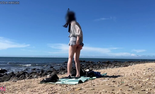 HA100Masturbating with a vibrator in shallow water at the beach
