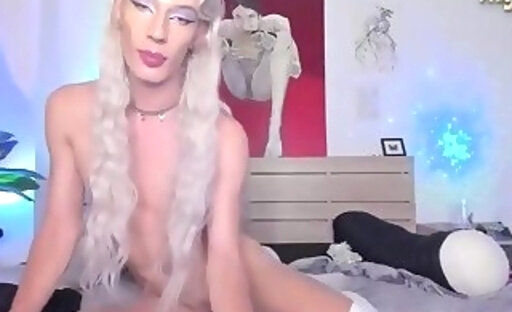 skinny transgirl in white stockings jerks off her big dick on webcam