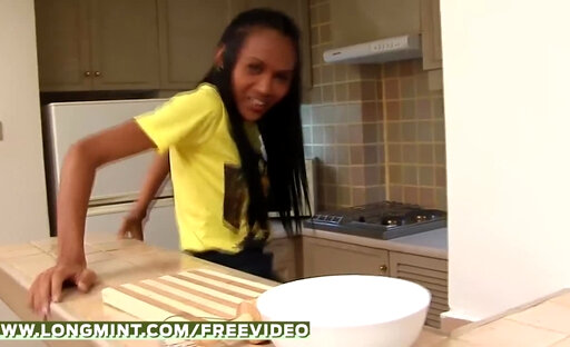 Tanned ladyboy gets kinky in the kitchen and strokes her monster cock