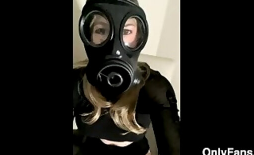 OnlyFans model Alexandra Braces is riding a dildo while wearing a latex gas mask