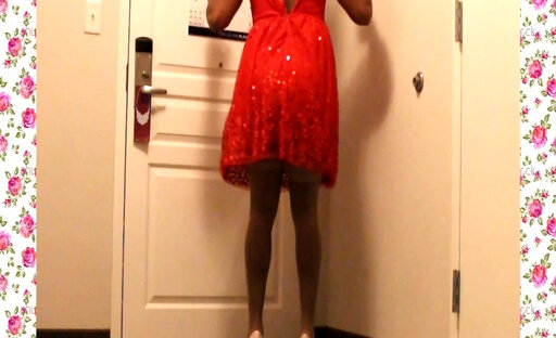 A 1950's SISSY DANCE FOR HER HUSBAND WEARING A PARTY DRESS
