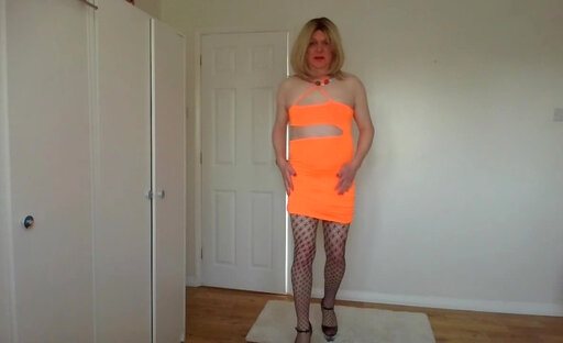 Orange minidress and fishnets