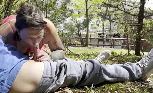 Kinky Inked TGirl Blowing her Lover's Cock Outdoors