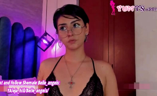 short haired glasses tgirl in stockings and lingerie vibrates her cock on cam