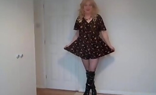 Black boots, short dress and pantyhose