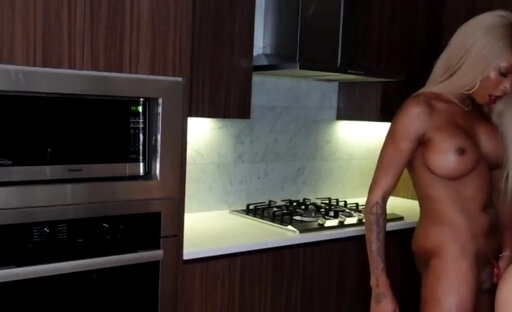 Busty ebony shemale rails a dude in the kitchen