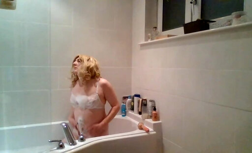 Blonde taking a soapy shower in bra and panties