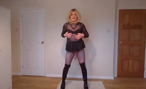 Gothic look with fishnets, miniskirt and boots