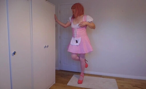 Strawberry blonde in pink costume and bra