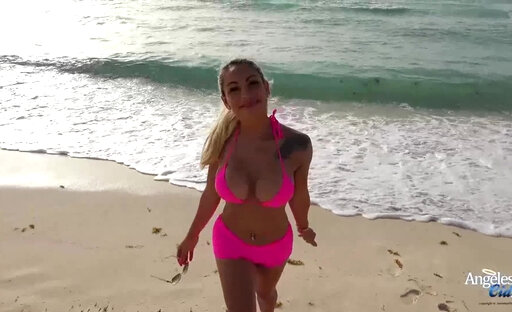 Busty blonde trans in a pink bikini and booty shorts