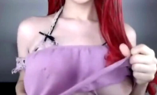 Redhead shemale shows her big tits on cam