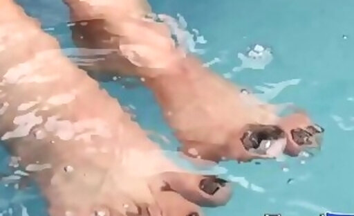 Beautiful chick with dick has solo feet play by the pool