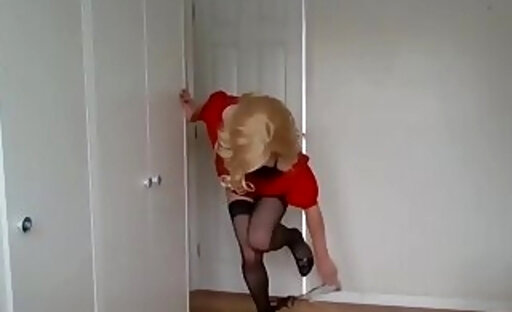 Blonde in stockings taking her black panties off