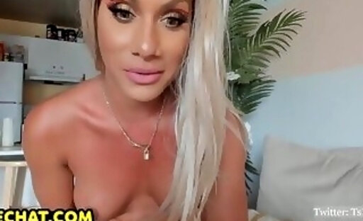 Beautiful blonde shemale interacts with her admirers