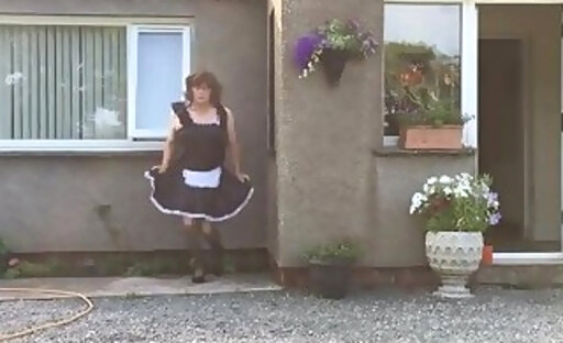 femboy maid neil in his maids suit outside his house