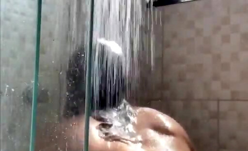 Giving her perfect body a warm shower