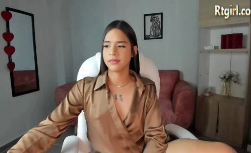 slim latina trans hottie with tattoos strokes her big shaft