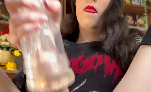 Olympia uses a fleshlight to stroke her big cock