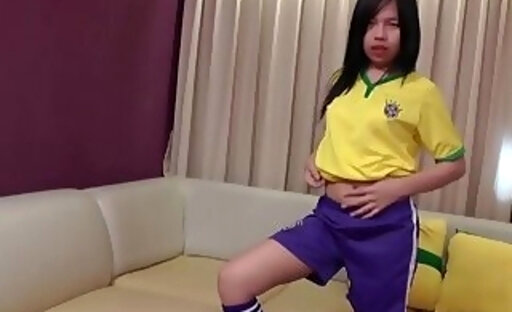 Brunette ladyboy in a football jersey strips white panties and rides a cock