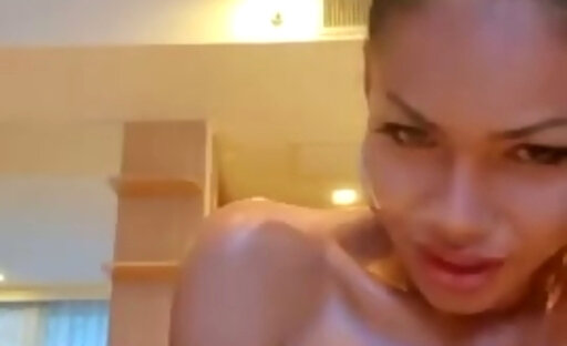 Sexy Ladyboy Peachy Lily cums while masturbating along with a dildo in her ass