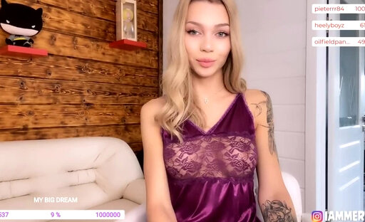 Lammery posing in a maroon silk camisole