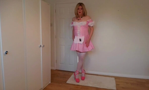 Blonde in stockings stripping out of a cute pink costume